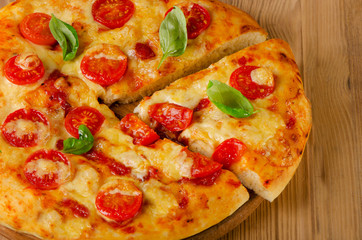 Italian pizza with tomatoes and cheese