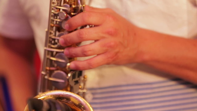 Musician Plays Saxophone. Close-up