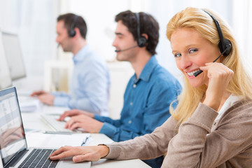 Young attractive woman working in a call center