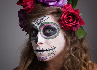 Halloween witch. Beautiful woman wearing santa muerte mask portr