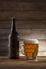 Beer on a wooden background with copy space