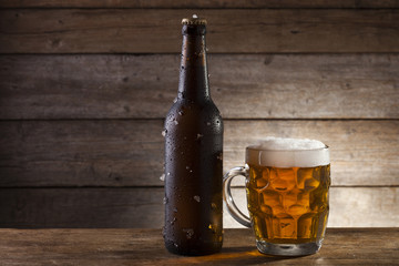 Beer on a wooden background with copy space