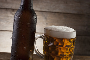 Beer on a wooden background with copy space