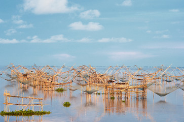Fototapeta na wymiar Water scape scene with square dip net in Patthalung,Thailand