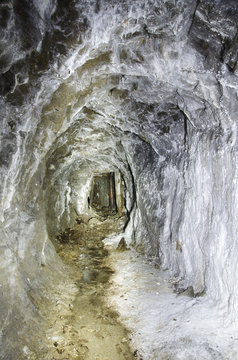 Abandoned mining adit with aragonite coatings