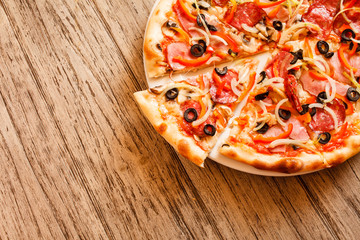 pizza on wooden background