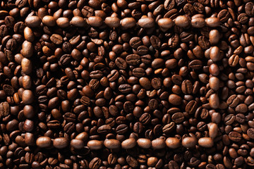 Frame of coffee beans on coffee beans