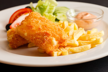 fried cheese with salad and potaotes