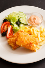 fried cheese with salad and potaotes