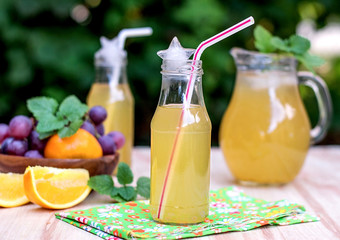 Fresh iced drinks with grapes and orange