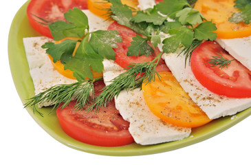 salad with tomatoes and mozzarella on an isolated background
