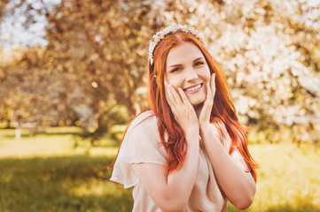 Beautiful girl with flowers in her hair. Spring.