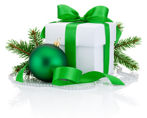White box tied green ribbon bow, pine tree branch and christmas