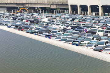 Parking a car lot where water will flood the roof cover.
