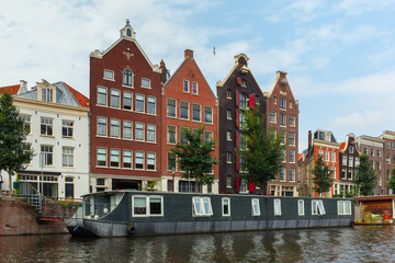 Obraz premium City view of Amsterdam canal and typical houses, Holland, Nether