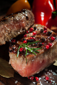 Succulent grilled fillet steak on an wooden board