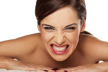 young beautiful woman gnash her teeth
