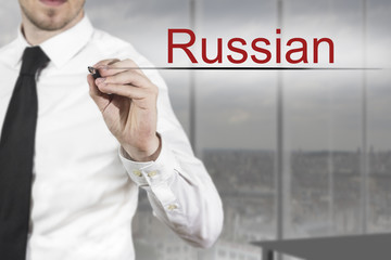 businessman writing russian in the air office