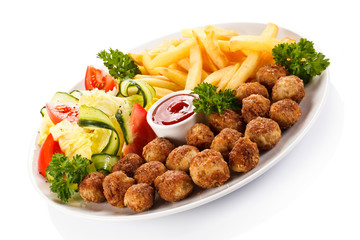 Roast meatballs, French fries and vegetable salad