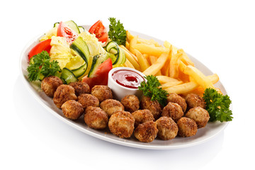 Roast meatballs, French fries and vegetable salad
