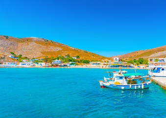 Fototapeta premium fishing boats at the port of Pserimos island in Greece