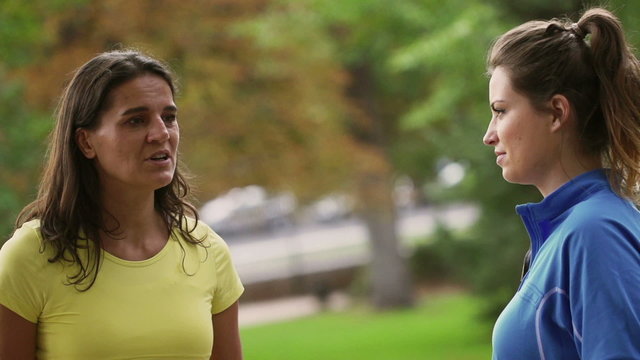 Sporty women chatting in the park, slow motion 240fps,steadycam