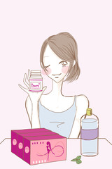 サプリメントボトルを持つ女性