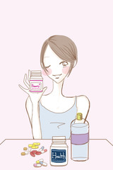 サプリメント錠剤と女性