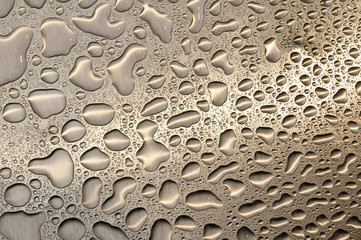 waterdrops on brushed metal