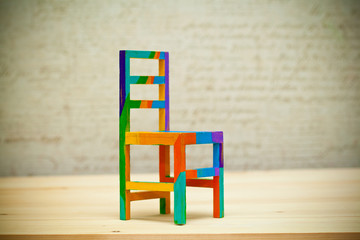 Toy multicolored wooden chair. Art handmade