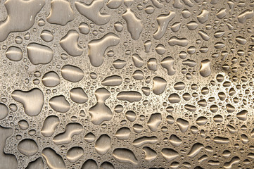 waterdrops on brushed metal