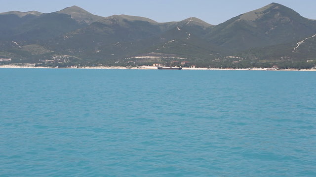 Summer panoramic view of the sea and mountain range