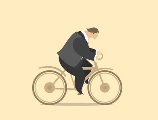 Young Happy Man In A Business Suit Riding Bicycle