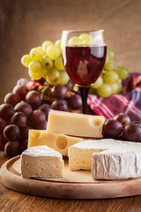 Cheese with a bottle and glasses of red wine