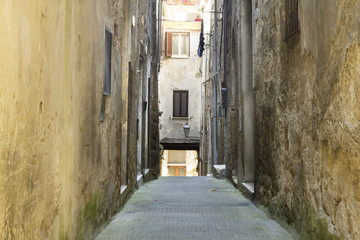 Fototapeta na wymiar Narrow stone street in a town from Tuscany