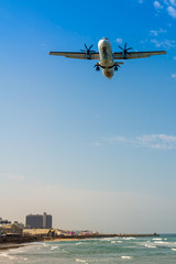Fototapeta na wymiar Airplane landing in Sde Dov