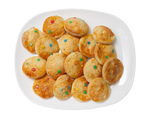 Homemade cookies on a white rectangular plate.
