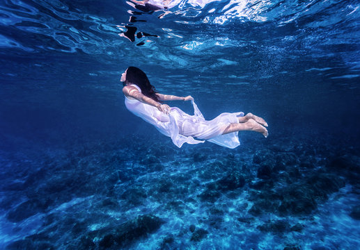 Swimming in beautiful blue sea