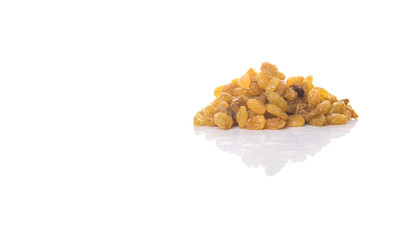 Golden colored dried raisin over white background