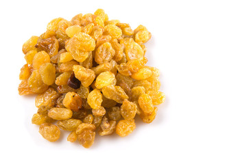 Golden colored dried raisin over white background