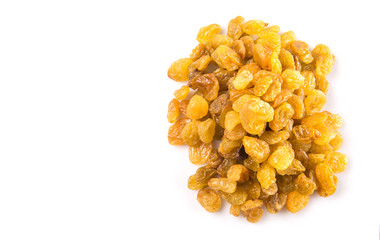 Golden colored dried raisin over white background