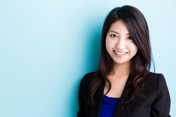 Fototapeta premium asian businesswoman on blue background