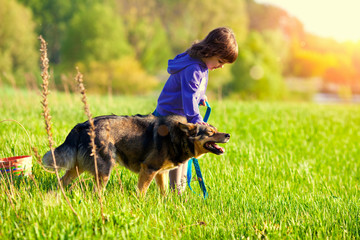 Little girl walking with dog