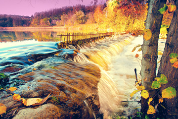 River with waterfall in autumn