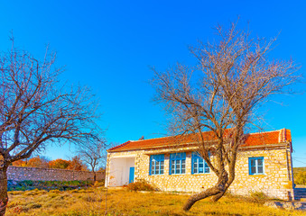 Fototapeta na wymiar the beautiful small school of Amygdalia village in Greece