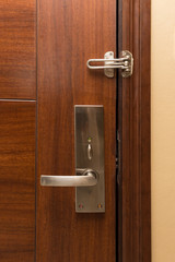 metal door handle on wooden door