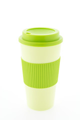 Green plastic coffee mug isolated on white background