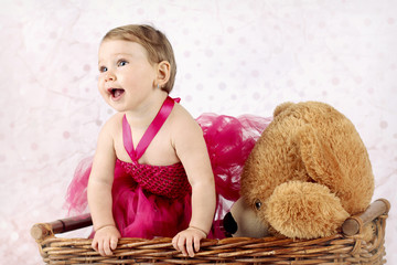 Beautiful little girl with big teddy bear in the wicker basket © allari