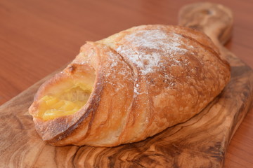 Fresh baked croissant with vanilla filling