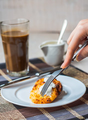 eat curd cheese pancakes with sour cream for breakfast, hands